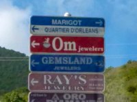 The night we arrived I had a hard time finding our accommodations. I had a pretty good idea of the layout of the island but wasn&#39;t getting much help from streetsigns. Here&#39;s an example. Only the thin, top segment is actually useful, the rest is advertising! Try reading these at night, in the rain, on busy narrow roads!